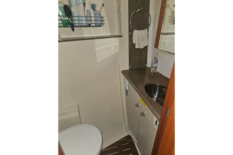 Slide: The Image of Wooden interior of 2013 Marlow-Hunter 50 aft cabin, featuring storage cabinets and drawers. - 43