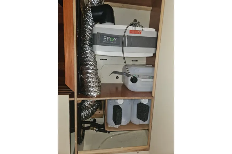 Slide: The Image of Shower area in 2013 Marlow-Hunter 50 aft cabin yacht, featuring wooden flooring. - 45