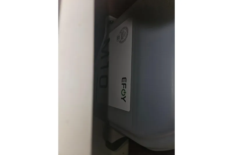 Slide: The Image of Shower area in 2013 Marlow-Hunter 50 aft cabin yacht with wooden bench. - 46