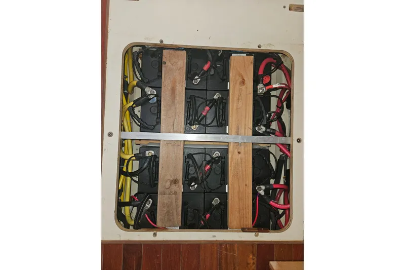 Slide: The Image of A 2013 Marlow-Hunter 50 aft cabin yacht docked, featuring a Highfield dinghy on top. - 5