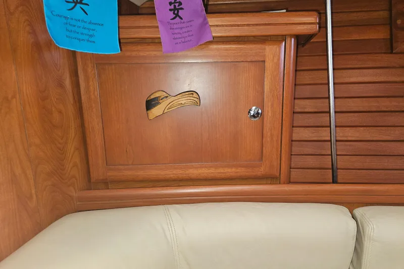 Slide: The Image of Aft deck of 2013 Marlow-Hunter 50, featuring teak flooring and stainless steel railings. - 9