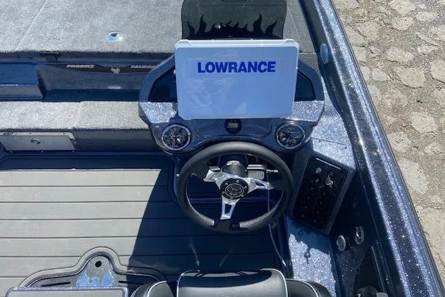 Slide: The Image of 2026 Phoenix 921 ELITE boat dashboard with Lowrance display and steering wheel. - 5