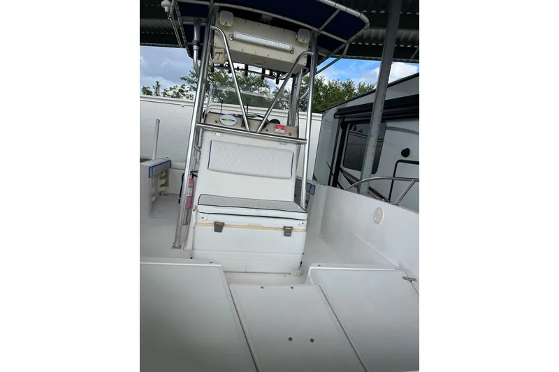 Slide: The Image of 2001 Key West 2300 Center Console boat interior with seating and console view. - 15