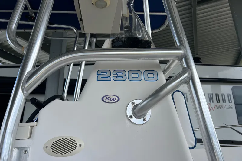 Slide: The Image of Key West 2300 Center Console boat, 2001 model, featuring stainless steel railings. - 18