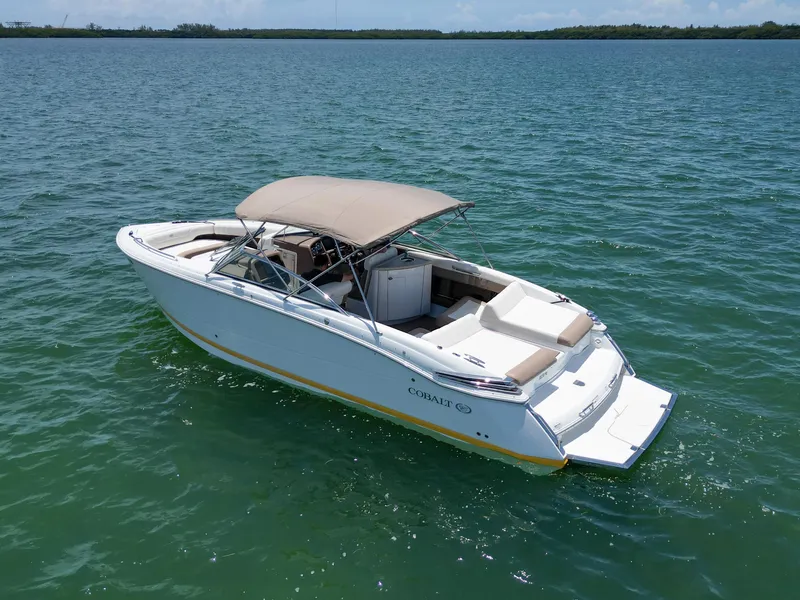 Slide: The Image of 2013 Cobalt 296 boat with canopy on calm water. - 3