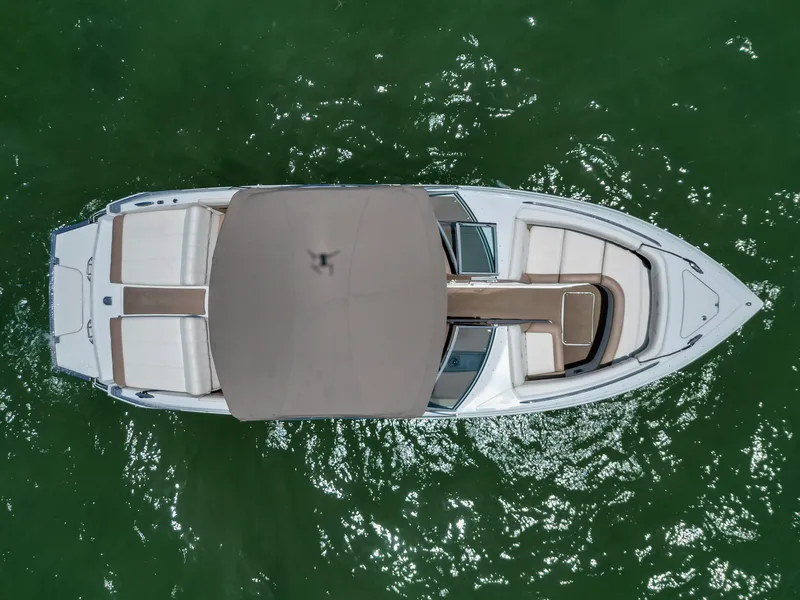 Slide: The Image of Overhead view of 2013 Cobalt 296 boat on green water. - 7