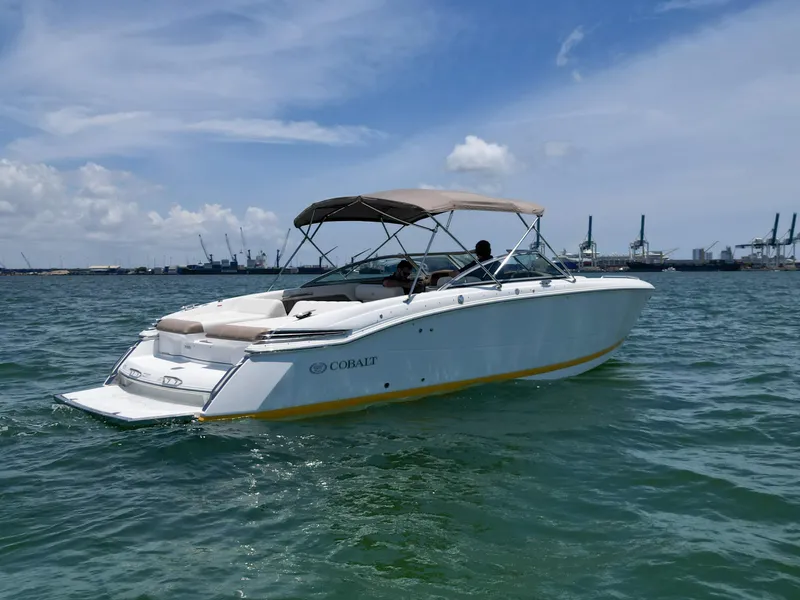 Slide: The Image of 2013 Cobalt 296 boat cruising on a sunny day with clear skies. - 8