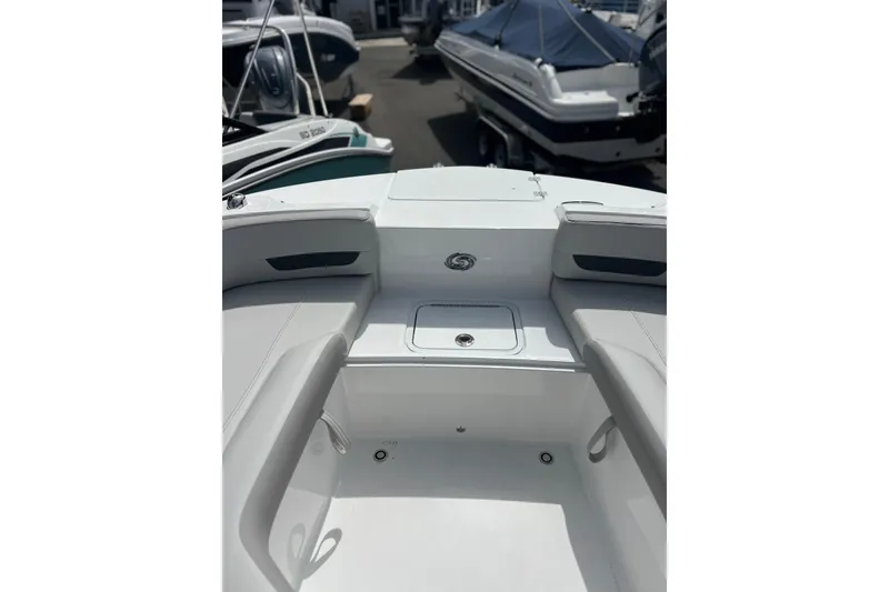 Slide: The Image of 2026 Hurricane SunDeck 235 OB boat interior with seating and storage. - 10