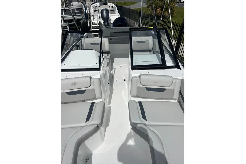 Slide: The Image of 2026 Hurricane SunDeck 235 OB boat interior with spacious seating and modern design. - 12