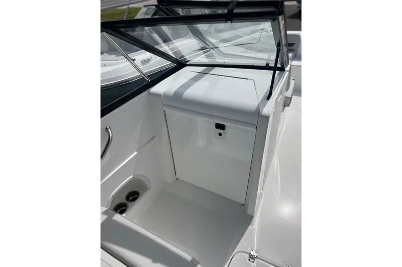 Slide: The Image of 2026 Hurricane SunDeck 235 OB boat interior with sleek white design and windshield. - 17