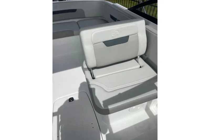 Slide: The Image of 2026 Hurricane SunDeck 235 OB boat seat, featuring sleek white and gray design. - 6