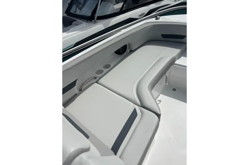 Slide: The Image of 2026 Hurricane SunDeck 235 OB boat interior with sleek seating and cup holders. - 8