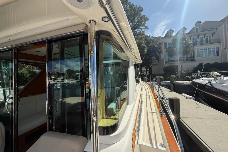 Slide: The Image of 2023 Sabre 43 Salon Express yacht docked, showcasing sleek design and luxurious interior. - 18