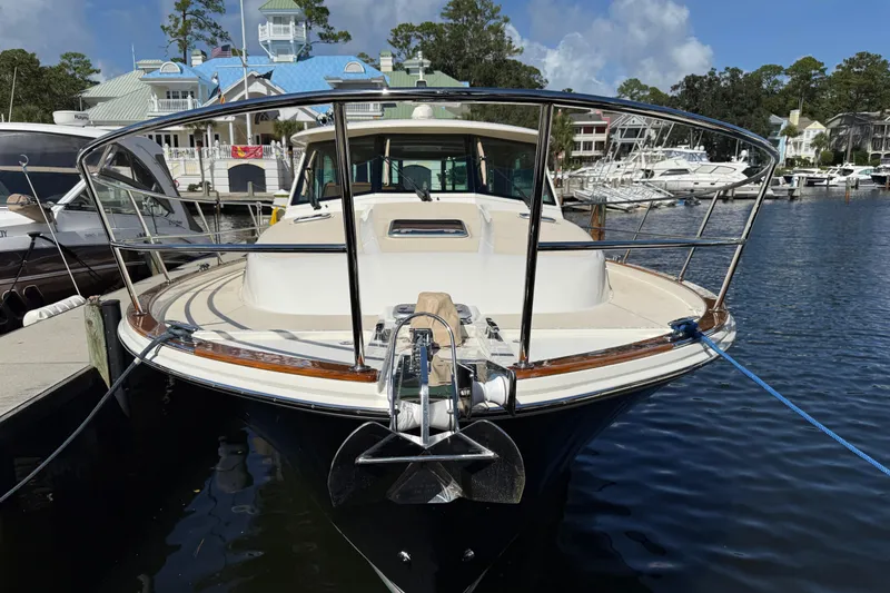 Slide: The Image of 2023 Sabre 43 Salon Express yacht docked at marina, front view. - 33