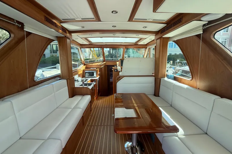 Slide: The Image of Luxurious interior of 2023 Sabre 43 Salon Express yacht with elegant wood and white seating. - 38