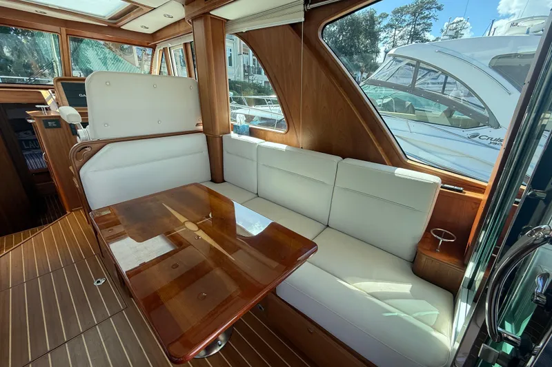 Slide: The Image of Interior of 2023 Sabre 43 Salon Express yacht with elegant seating and wooden table. - 53