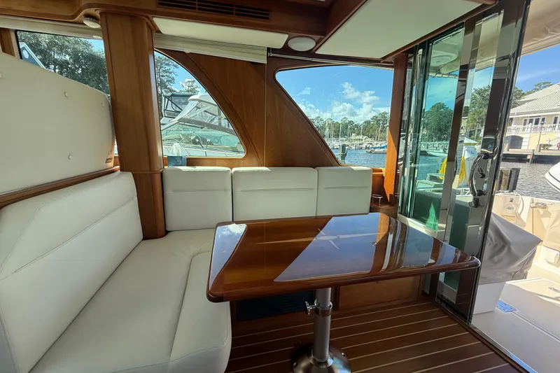 Slide: The Image of Interior of 2023 Sabre 43 Salon Express yacht with elegant seating and wooden table. - 55