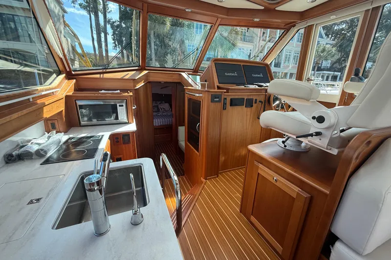 Slide: The Image of Interior of 2023 Sabre 43 Salon Express yacht with modern kitchen and helm. - 57