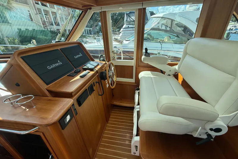 Slide: The Image of 2023 Sabre 43 Salon Express helm with Garmin displays and luxurious seating. - 61
