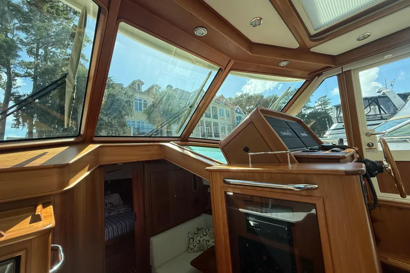 Slide: The Image of Interior view of 2023 Sabre 43 Salon Express yacht with wooden finishes and navigation equipment. - 67