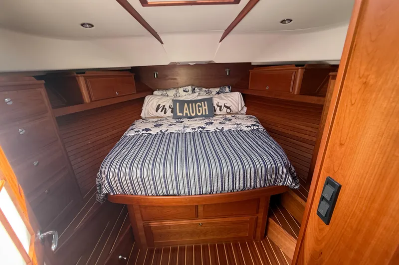 Slide: The Image of 2023 Sabre 43 Salon Express cabin with cozy bed and wooden interior. - 69