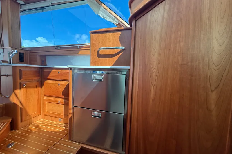 Slide: The Image of Interior of 2023 Sabre 43 Salon Express yacht with wooden cabinetry and stainless steel appliances. - 73