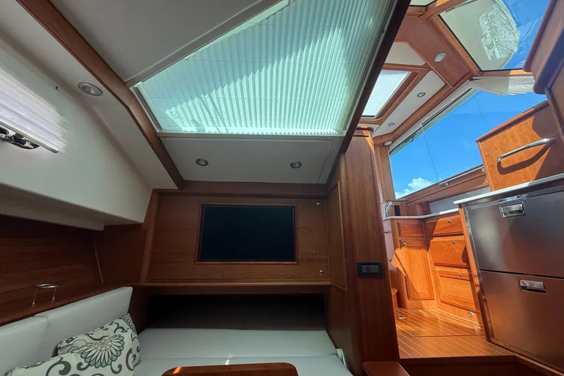 Slide: The Image of Interior of 2023 Sabre 43 Salon Express yacht with skylight and wooden finishes. - 75