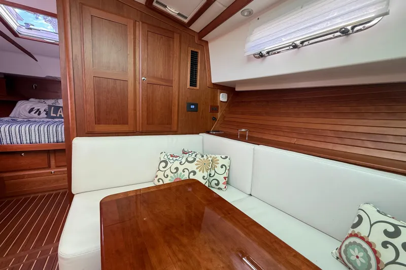 Slide: The Image of Luxurious interior of 2023 Sabre 43 Salon Express yacht with wood paneling and cozy seating. - 76