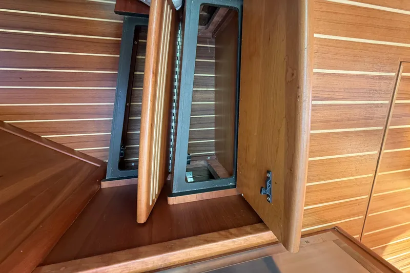 Slide: The Image of Open wooden cabinet on 2023 Sabre 43 Salon Express yacht interior. - 78
