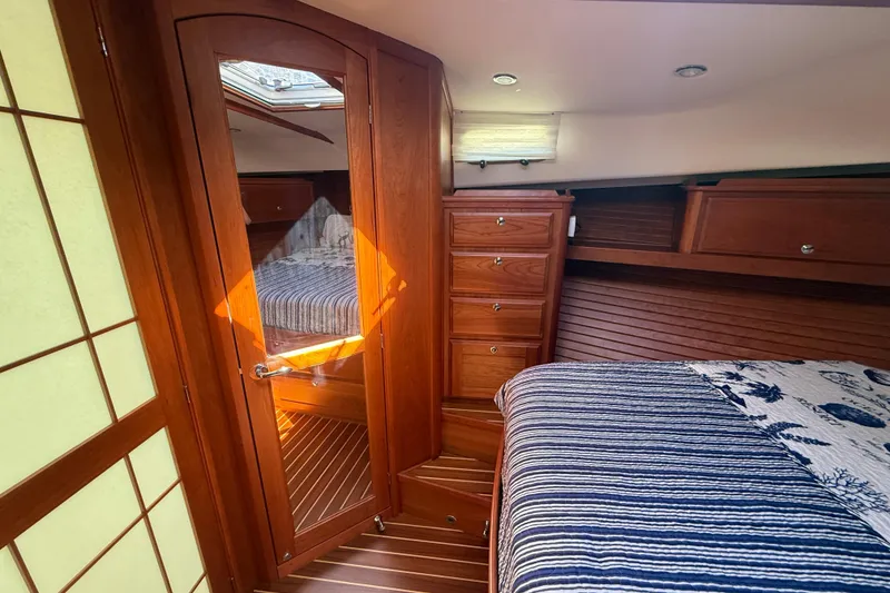 Slide: The Image of Luxurious interior of 2023 Sabre 43 Salon Express yacht cabin with wooden finishes. - 83