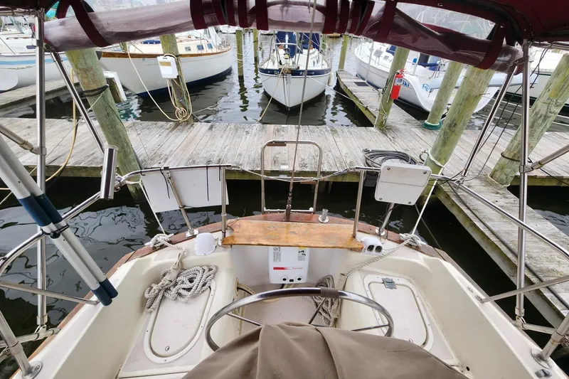 Slide: The Image of Up close view of helm instruments . Pearson 323 sailboat cockpit with Raymarine navigation equipment and compass, 1982 model. - 20