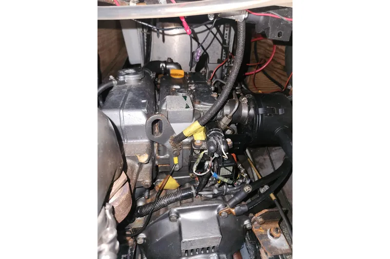 Slide: The Image of Storage compartment on 1982 Pearson 323 sailboat with coiled yellow power cable. - 24