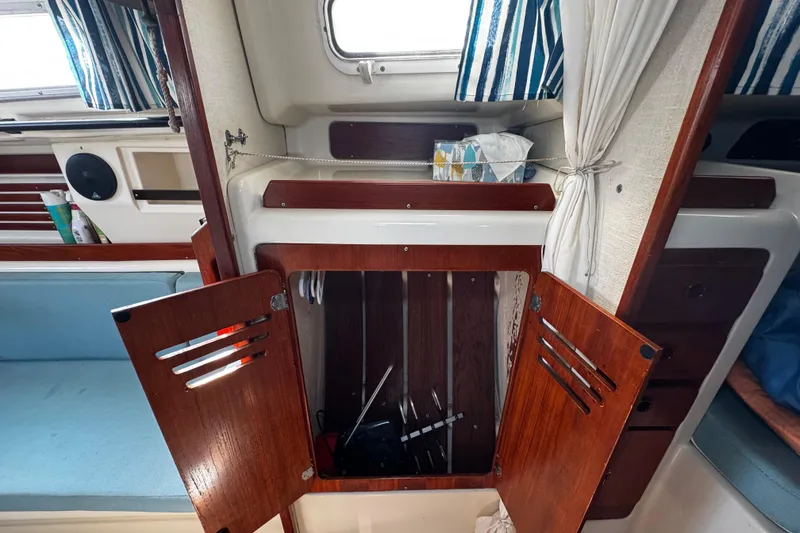 Slide: The Image of view of interior of closet storage opposite the head area - 57