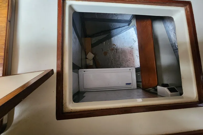Slide: The Image of Interior view of a 1982 Pearson 323 sailboat storage compartment. - 36