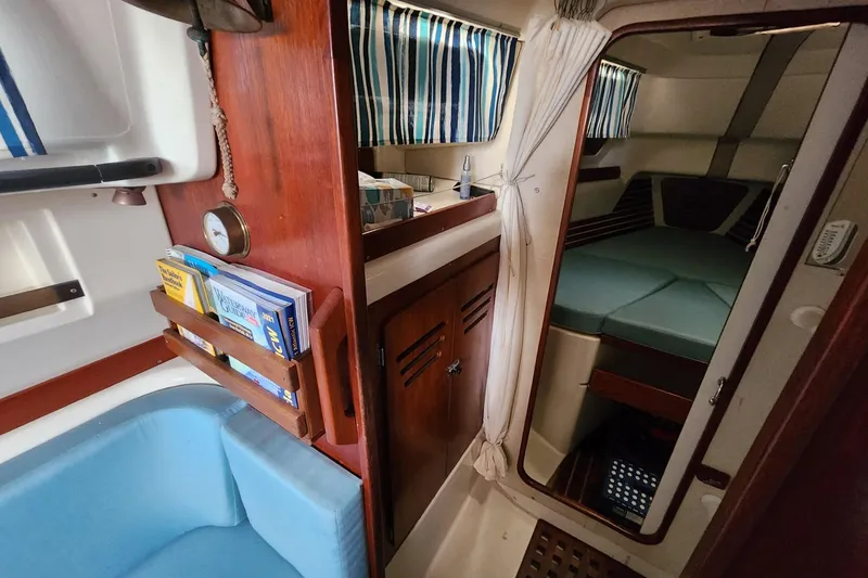 Slide: The Image of Interior of a 1982 Pearson 323 sailboat with cozy cabin and nautical decor. - 38