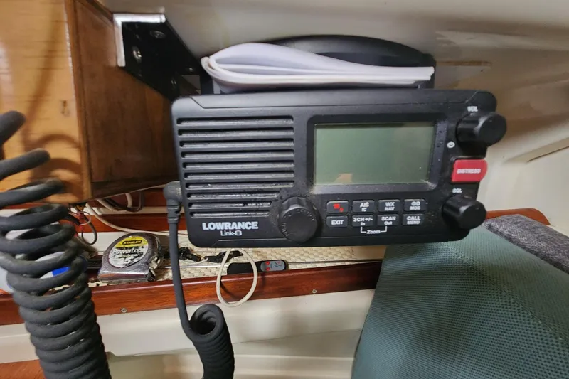 Slide: The Image of VHF radio on 1982 Pearson 323 sailboat, featuring Lowrance Link-8 model. - 44