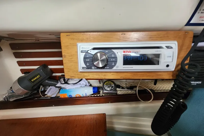 Slide: The Image of Stereo system and tools inside a 1982 Pearson 323 sailboat cabin. - 45