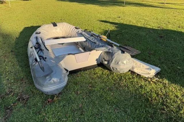 Slide: The Image of Inflatable boat on grass, Pearson 323 model, 1982. - 47