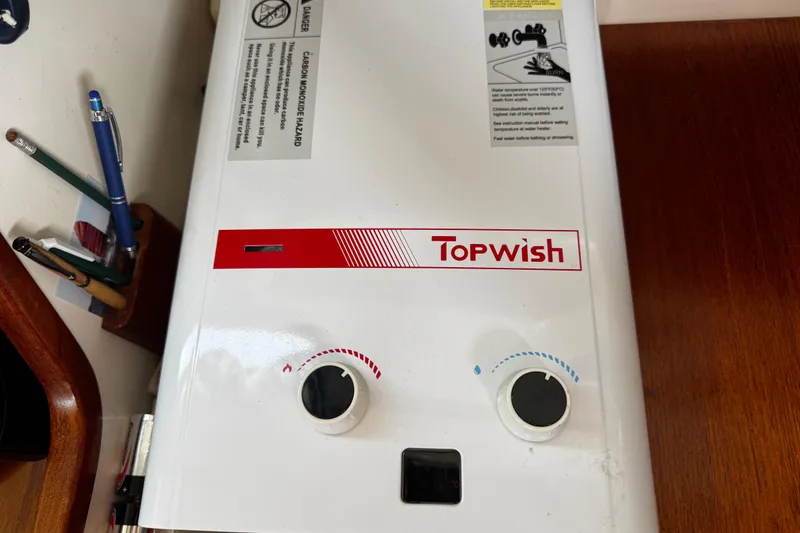 Slide: The Image of on demand hot water heater - 77