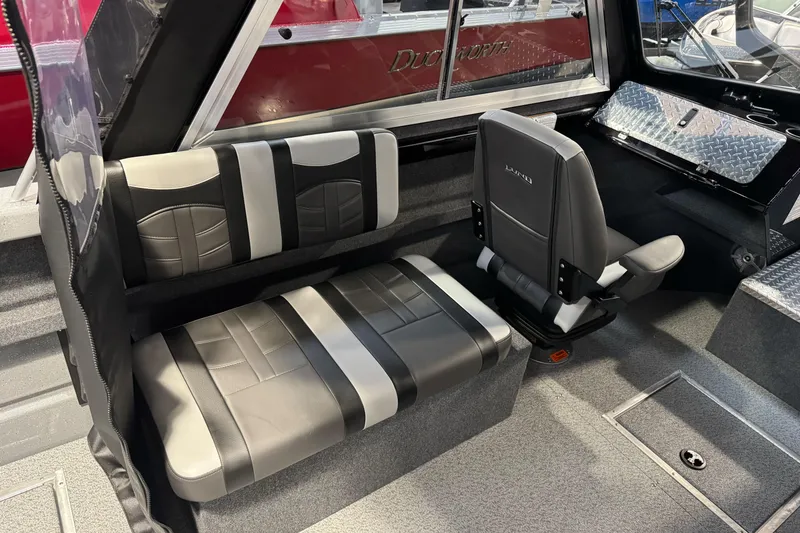 Slide: The Image of Interior of 2026 Lund 200 Heavy Gauge boat with stylish seating and modern design. - 23
