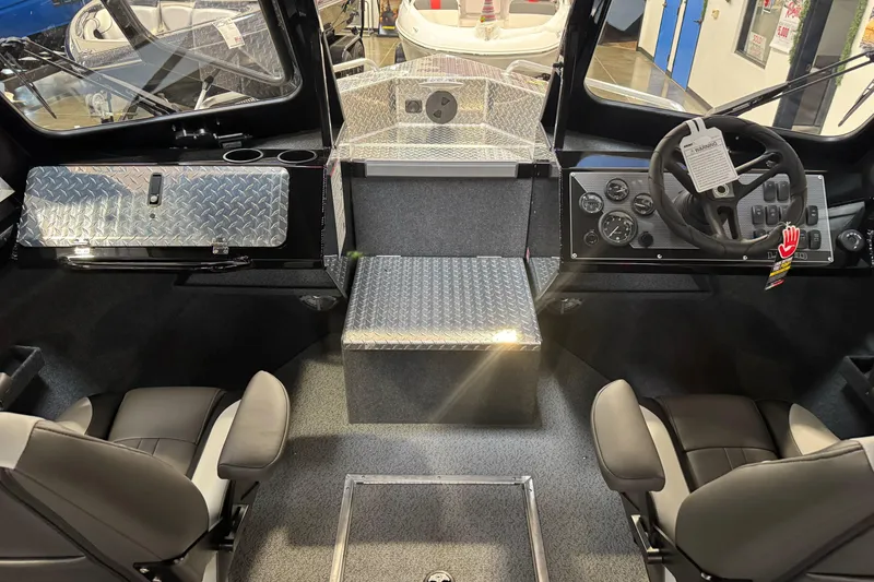 Slide: The Image of Interior of 2026 Lund 200 Heavy Gauge boat with modern dashboard and seating. - 26