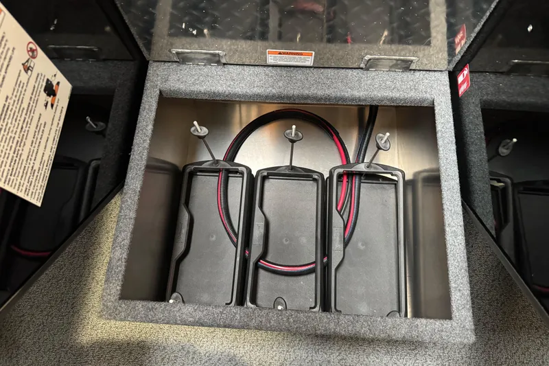 Slide: The Image of Battery compartment of 2026 Lund 200 Heavy Gauge boat, featuring secure wiring setup. - 29