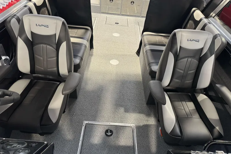 Slide: The Image of Interior of 2026 Lund 200 Heavy Gauge boat with four black and gray seats. - 31