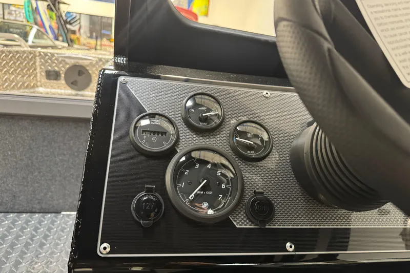 Slide: The Image of Dashboard of 2026 Lund 200 Heavy Gauge boat with gauges and controls. - 37