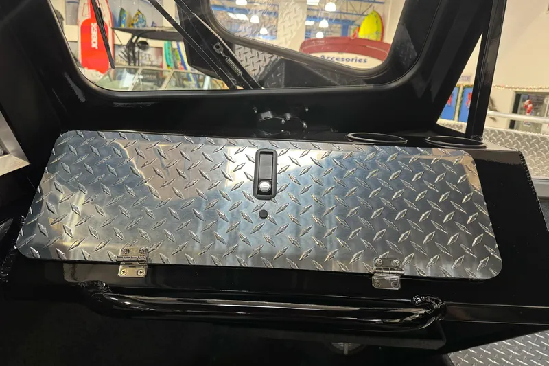 Slide: The Image of Diamond plate storage compartment in 2026 Lund 200 Heavy Gauge boat interior. - 39
