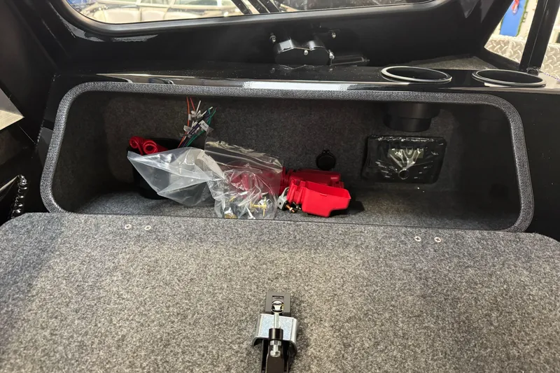 Slide: The Image of Interior storage compartment of 2026 Lund 200 Heavy Gauge boat with wiring and accessories. - 40