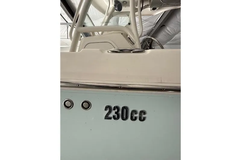 Slide: The Image of 2013 Everglades 230 Center Console boat, close-up view of model number "230cc". - 11