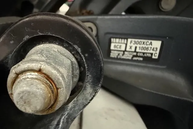Slide: The Image of Close-up of a Yamaha F300XCA engine part on a 2013 Everglades 230 Center Console boat. - 13