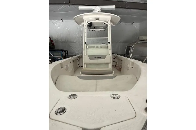 Slide: The Image of 2013 Everglades 230 Center Console boat interior with seating and console view. - 14