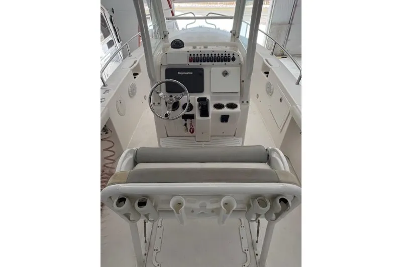 Slide: The Image of 2013 Everglades 230 Center Console boat interior with steering wheel and control panel. - 19